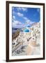 Greek Church with Three Blue Domes in the Village of Oia-Neale Clark-Framed Photographic Print