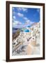 Greek Church with Three Blue Domes in the Village of Oia-Neale Clark-Framed Photographic Print