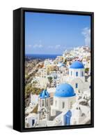 Greek Church with Three Blue Domes in the Village of Oia-Neale Clark-Framed Stretched Canvas