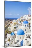 Greek Church with Three Blue Domes in the Village of Oia-Neale Clark-Mounted Photographic Print