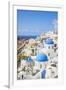 Greek Church with Three Blue Domes in the Village of Oia-Neale Clark-Framed Photographic Print