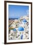 Greek Church with Three Blue Domes in the Village of Oia-Neale Clark-Framed Photographic Print