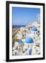 Greek Church with Three Blue Domes in the Village of Oia-Neale Clark-Framed Photographic Print