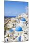 Greek Church with Three Blue Domes in the Village of Oia-Neale Clark-Mounted Photographic Print