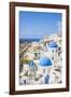 Greek Church with Three Blue Domes in the Village of Oia-Neale Clark-Framed Photographic Print