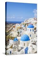 Greek Church with Three Blue Domes in the Village of Oia-Neale Clark-Stretched Canvas