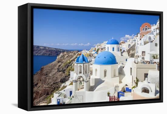 Greek Church with Three Blue Domes in the Village of Oia-Neale Clark-Framed Stretched Canvas