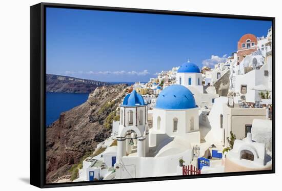 Greek Church with Three Blue Domes in the Village of Oia-Neale Clark-Framed Stretched Canvas