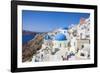 Greek Church with Three Blue Domes in the Village of Oia-Neale Clark-Framed Photographic Print