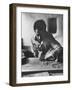 Greek Mountain Villager Engaged in Woodworking During the Winter-James Burke-Framed Photographic Print