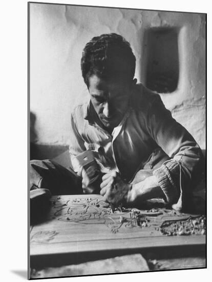 Greek Mountain Villager Engaged in Woodworking During the Winter-James Burke-Mounted Photographic Print