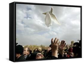 Greek Orthodox Priest Releases a Dove During a Traditional Ceremony at Jordan River Baptismal Site-null-Framed Stretched Canvas