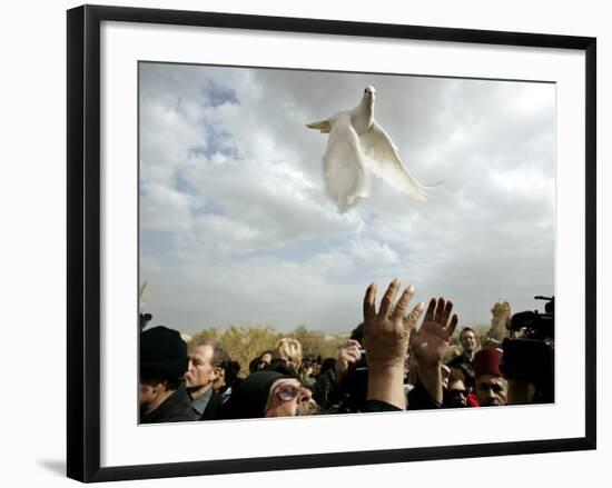 Greek Orthodox Priest Releases a Dove During a Traditional Ceremony at Jordan River Baptismal Site-null-Framed Photographic Print