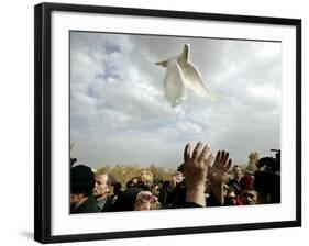 Greek Orthodox Priest Releases a Dove During a Traditional Ceremony at Jordan River Baptismal Site-null-Framed Photographic Print