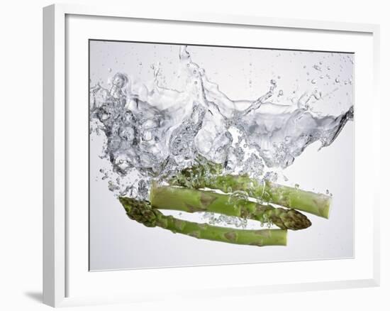 Green Asparagus Falling into Water-Kröger & Gross-Framed Photographic Print