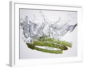 Green Asparagus Falling into Water-Kröger & Gross-Framed Photographic Print