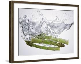 Green Asparagus Falling into Water-Kröger & Gross-Framed Photographic Print