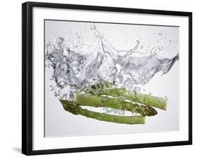 Green Asparagus Falling into Water-Kröger & Gross-Framed Photographic Print