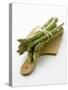 Green Asparagus on Chopping Board-Klaus Arras-Stretched Canvas