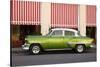 Green vintage American car parked in front of cafe, Cienfuegos, Cuba-Ed Hasler-Stretched Canvas