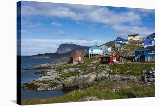 Greenland. Itilleq. Colorful houses dot the hillside.-Inger Hogstrom-Stretched Canvas