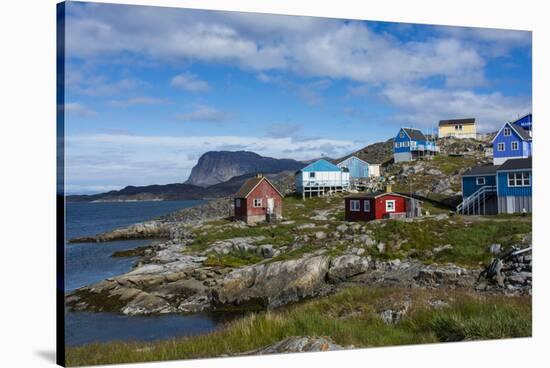 Greenland. Itilleq. Colorful houses dot the hillside.-Inger Hogstrom-Stretched Canvas