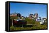 Greenland. Sisimiut. Fishing boats and colorful houses.-Inger Hogstrom-Framed Stretched Canvas