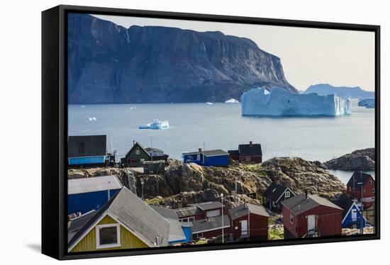 Greenland. Uummannaq. Colorful houses dot the rocky landscape.-Inger Hogstrom-Framed Stretched Canvas