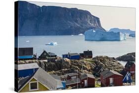 Greenland. Uummannaq. Colorful houses dot the rocky landscape.-Inger Hogstrom-Stretched Canvas