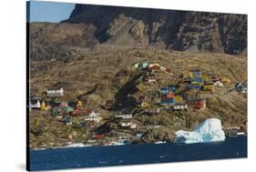 Greenland, Uummannaq. Colorful houses dot the rocky landscape.-Inger Hogstrom-Stretched Canvas