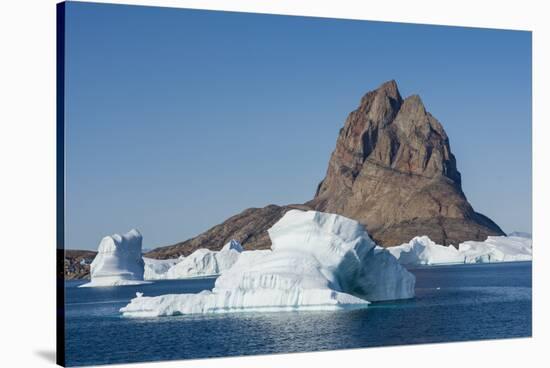 Greenland. Uummannaq. Uummannaq mountain and iceberg.-Inger Hogstrom-Stretched Canvas