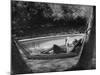 Greer Garson Reading While Relaxing in a Hammock Near Her Pool at Home-Peter Stackpole-Mounted Premium Photographic Print