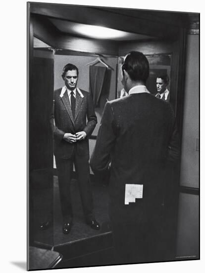 Gregory Peck Trying on Suit for His New Movie Man in the Grey Flannel Suit-Michael Rougier-Mounted Premium Photographic Print