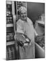 Grocer E.G. Guthart Displaying One of His Steaks-Francis Miller-Mounted Photographic Print