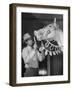 Groom Cleaning Horse's Teeth During Filming of the Movie "The Ziegfeld Follies"-John Florea-Framed Photographic Print
