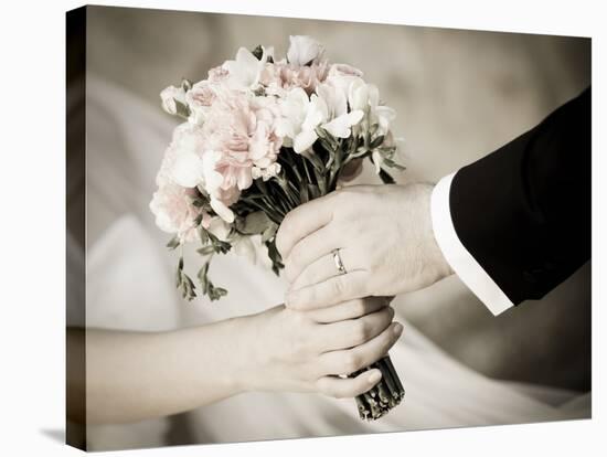 Groom Handing Wedding Bouquet to Bride-melis-Stretched Canvas