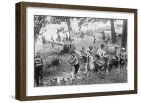 Group of Boys Carry Loaves of Bread from Wagons Near Beach Front in Woods.-null-Framed Art Print