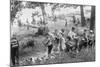 Group of Boys Carry Loaves of Bread from Wagons Near Beach Front in Woods.-null-Mounted Art Print