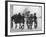 Group of Boys Lean Against the Dock Railings and Watch a Steamship Being Built-null-Framed Art Print