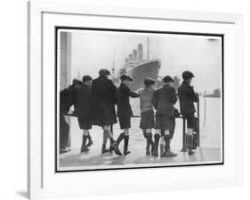 Group of Boys Lean Against the Dock Railings and Watch a Steamship Being Built-null-Framed Art Print