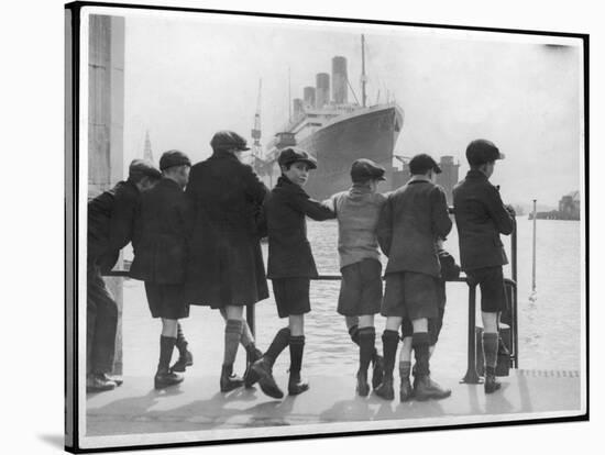 Group of Boys Lean Against the Dock Railings and Watch a Steamship Being Built-null-Stretched Canvas