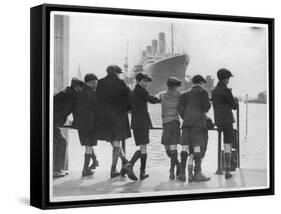 Group of Boys Lean Against the Dock Railings and Watch a Steamship Being Built-null-Framed Stretched Canvas