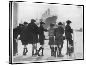 Group of Boys Lean Against the Dock Railings and Watch a Steamship Being Built-null-Stretched Canvas