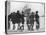 Group of Boys Lean Against the Dock Railings and Watch a Steamship Being Built-null-Stretched Canvas