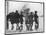 Group of Boys Lean Against the Dock Railings and Watch a Steamship Being Built-null-Mounted Art Print