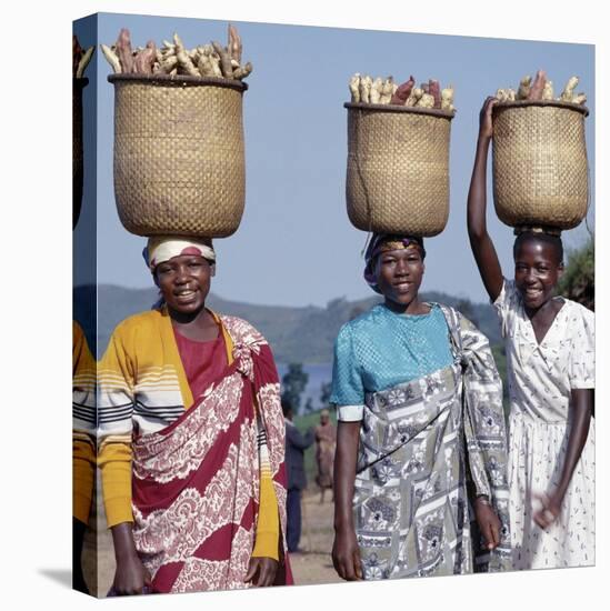 Group of Cheerful Women Carry Sweet Potatoes to Market in Traditional Split-Bamboo Baskets-Nigel Pavitt-Stretched Canvas