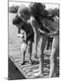 Group of Children Fishing from a Jetty-null-Mounted Photographic Print