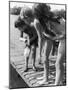 Group of Children Fishing from a Jetty-null-Mounted Photographic Print