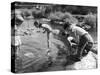 Group of Children Fishing with Nets in a Country Stream-null-Stretched Canvas