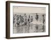 Group of Children in Striped Bathing Costumes Paddle Happily in the Surf at Heyst Sur Mer Belgium-null-Framed Photographic Print